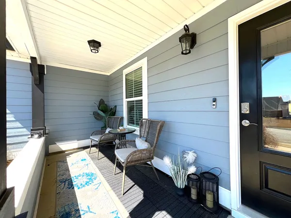a view of an entryway with wooden floor