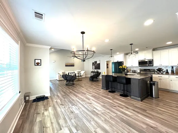 a kitchen with a sink and lots of wooden cabinets