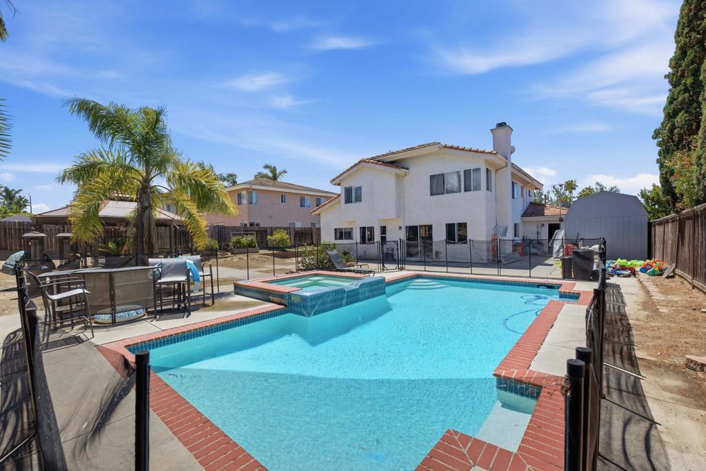 2077 Westwood Road Vista, CA 92083 - Photo 28 of 37 a view of a house with swimming pool and sitting area