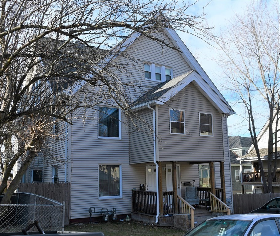 12-14 Longview Street Springfield, MA 01108 - Photo 1 of 42 a front view of a house with garage