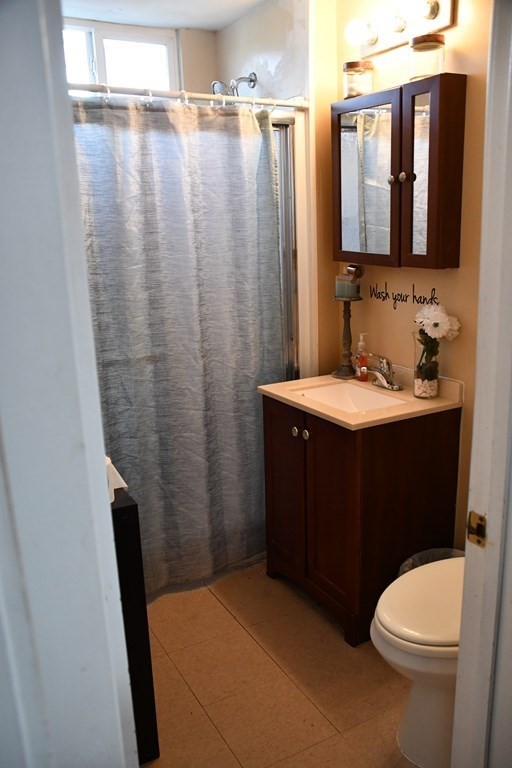 12-14 Longview Street Springfield, MA 01108 - Photo 17 of 42 a bathroom with a sink a toilet and shower