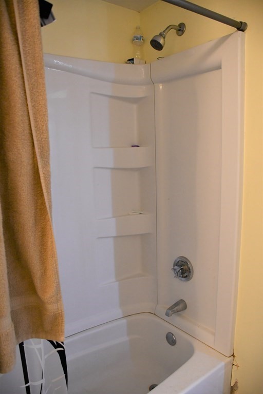12-14 Longview Street Springfield, MA 01108 - Photo 35 of 42 a bathroom with a tub and shower