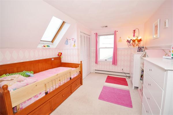 130 Stow Road Boxborough, MA 01719 - Photo 15 of 19 a spacious bedroom with a bed and a window