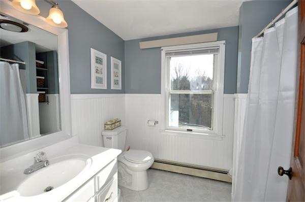 130 Stow Road Boxborough, MA 01719 - Photo 17 of 19 a bathroom with a sink toilet and window