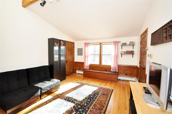130 Stow Road Boxborough, MA 01719 - Photo 4 of 19 a bedroom with a bed and wooden floor