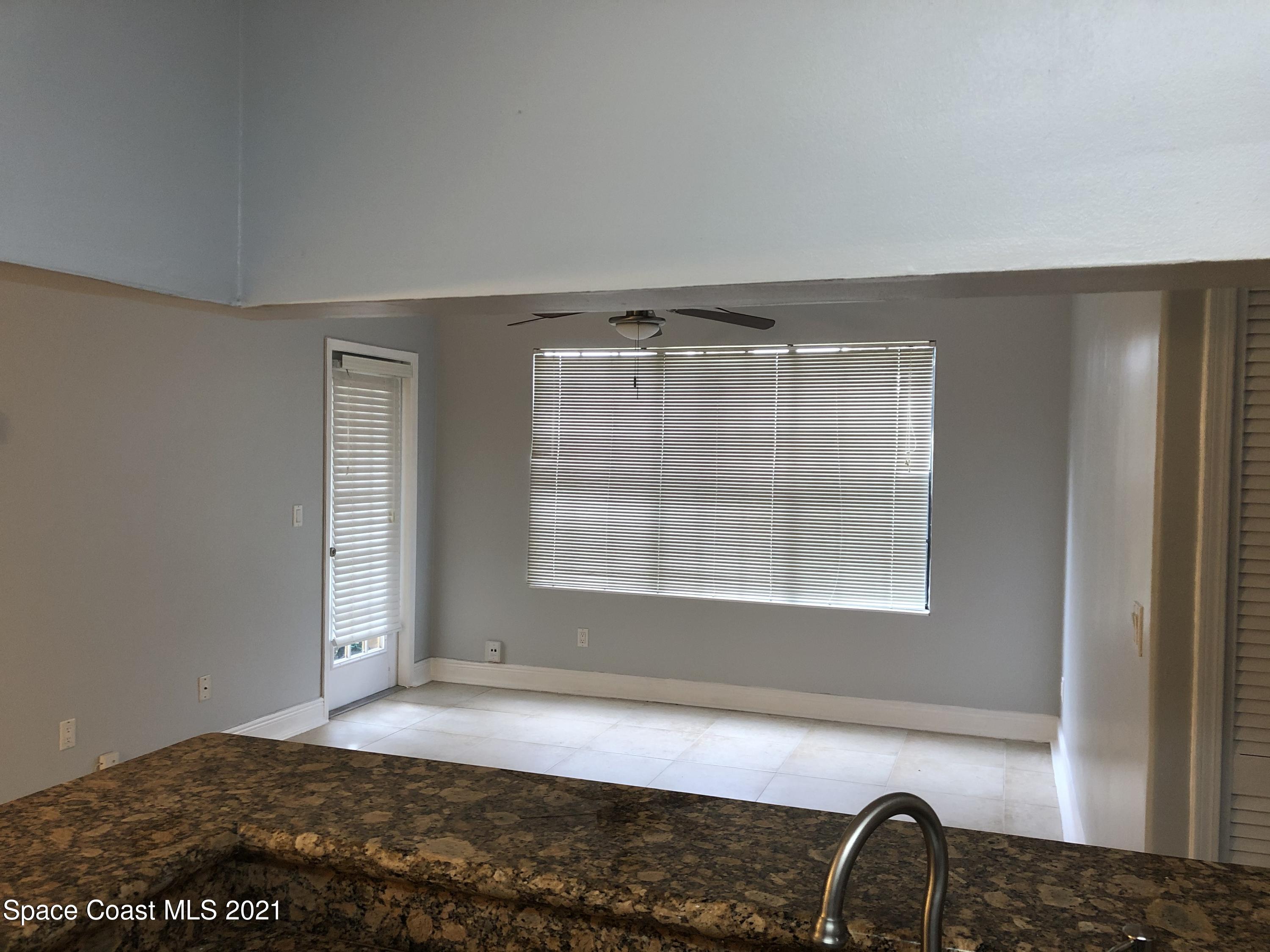 7667 North Wickham Road, Unit 406 Melbourne, FL 32940 - Photo 11 of 28 KITCHEN LIVING ROOM