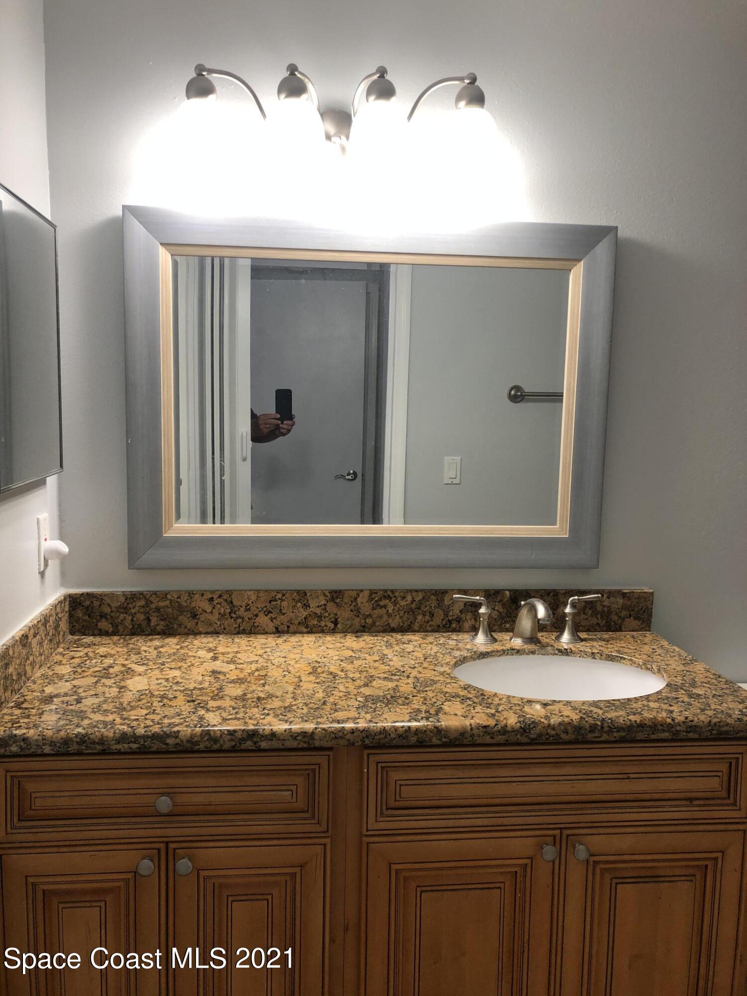 7667 North Wickham Road, Unit 406 Melbourne, FL 32940 - Photo 12 of 28 BATHROOM 1