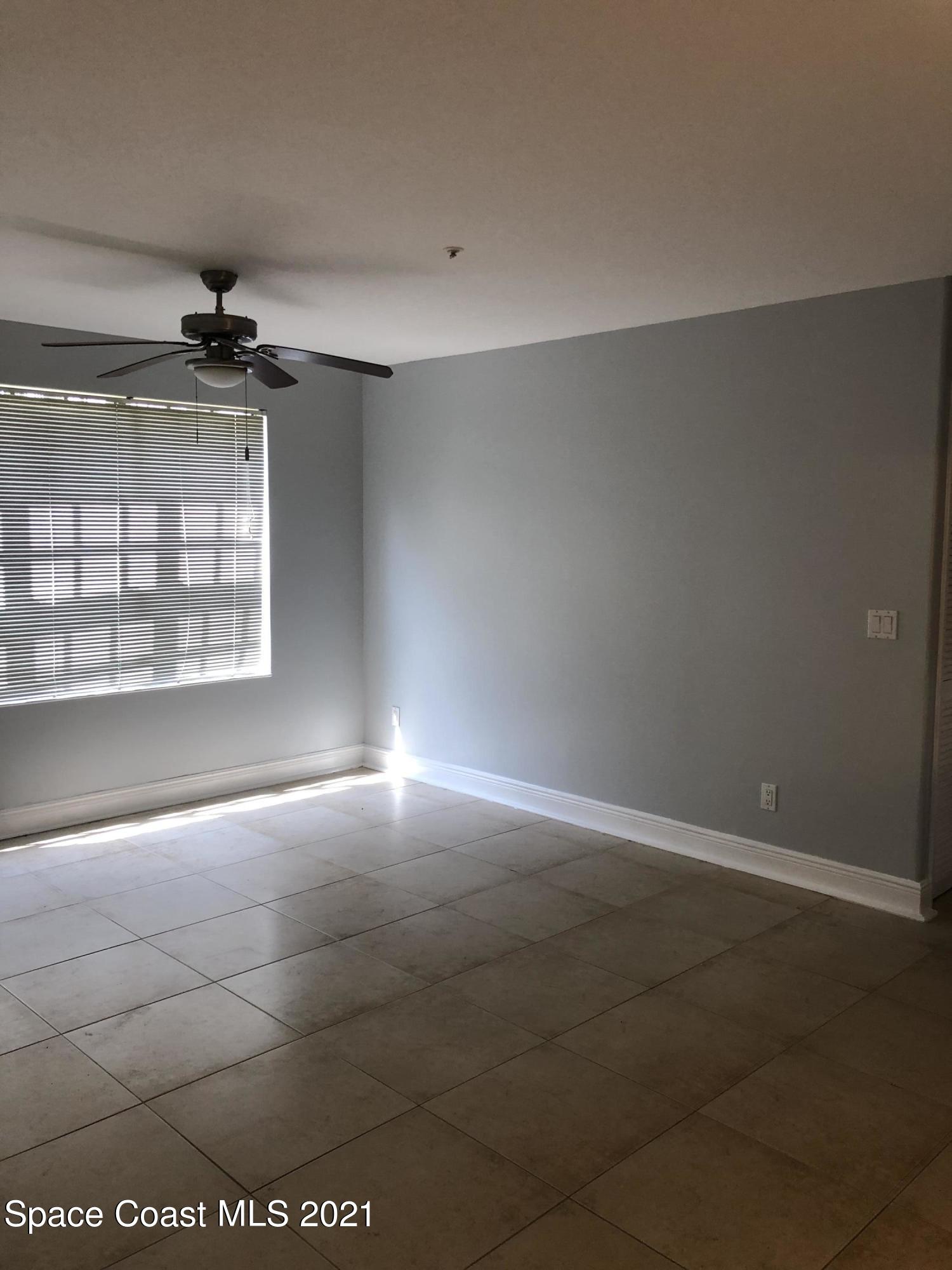 7667 North Wickham Road, Unit 406 Melbourne, FL 32940 - Photo 13 of 28 LIVING ROOM 2