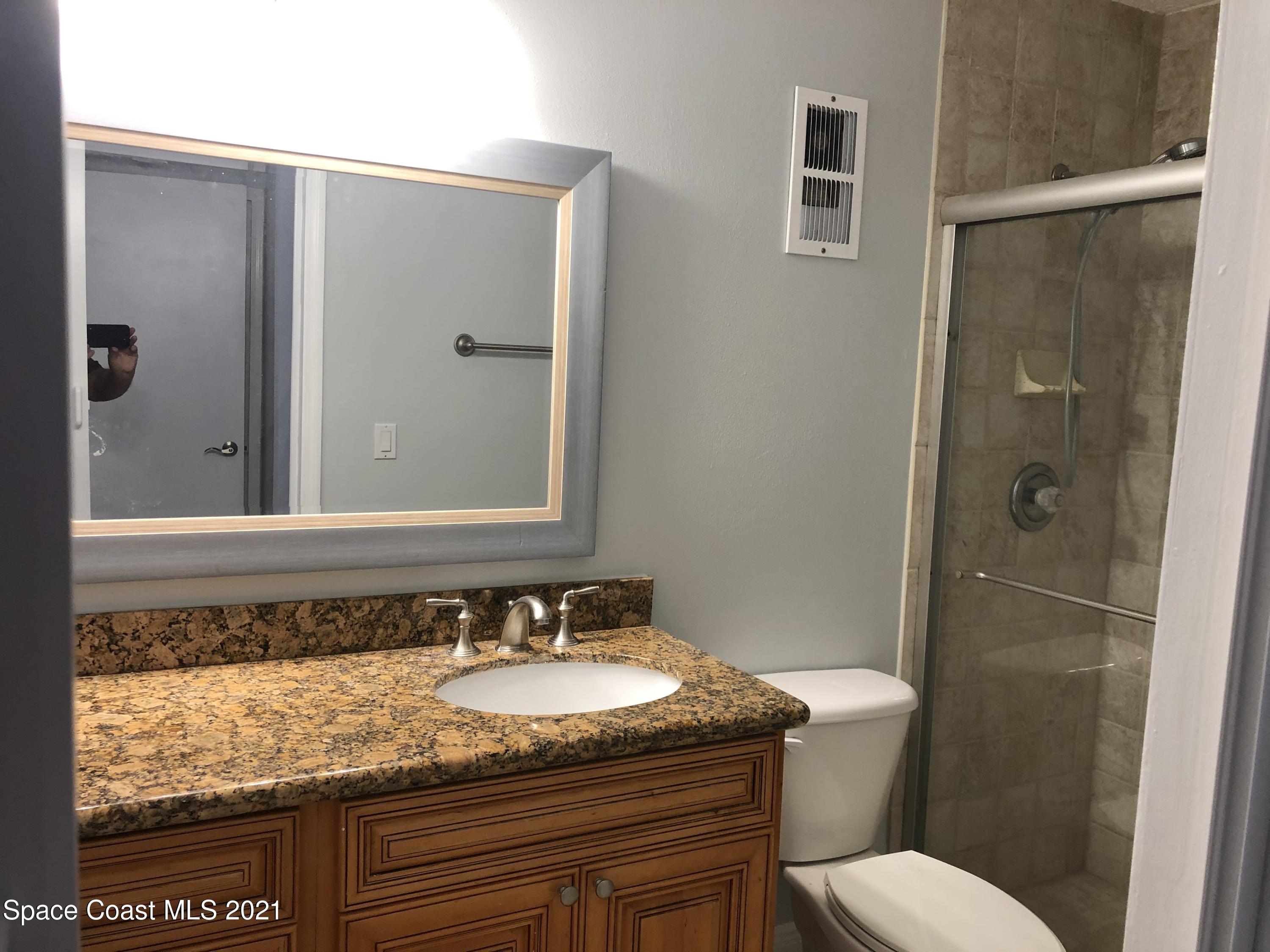 7667 North Wickham Road, Unit 406 Melbourne, FL 32940 - Photo 18 of 28 BATHROOM 2