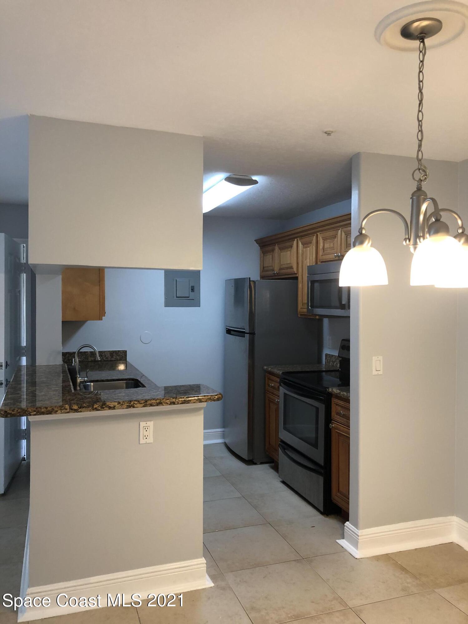 7667 North Wickham Road, Unit 406 Melbourne, FL 32940 - Photo 8 of 28 KITCHEN 2