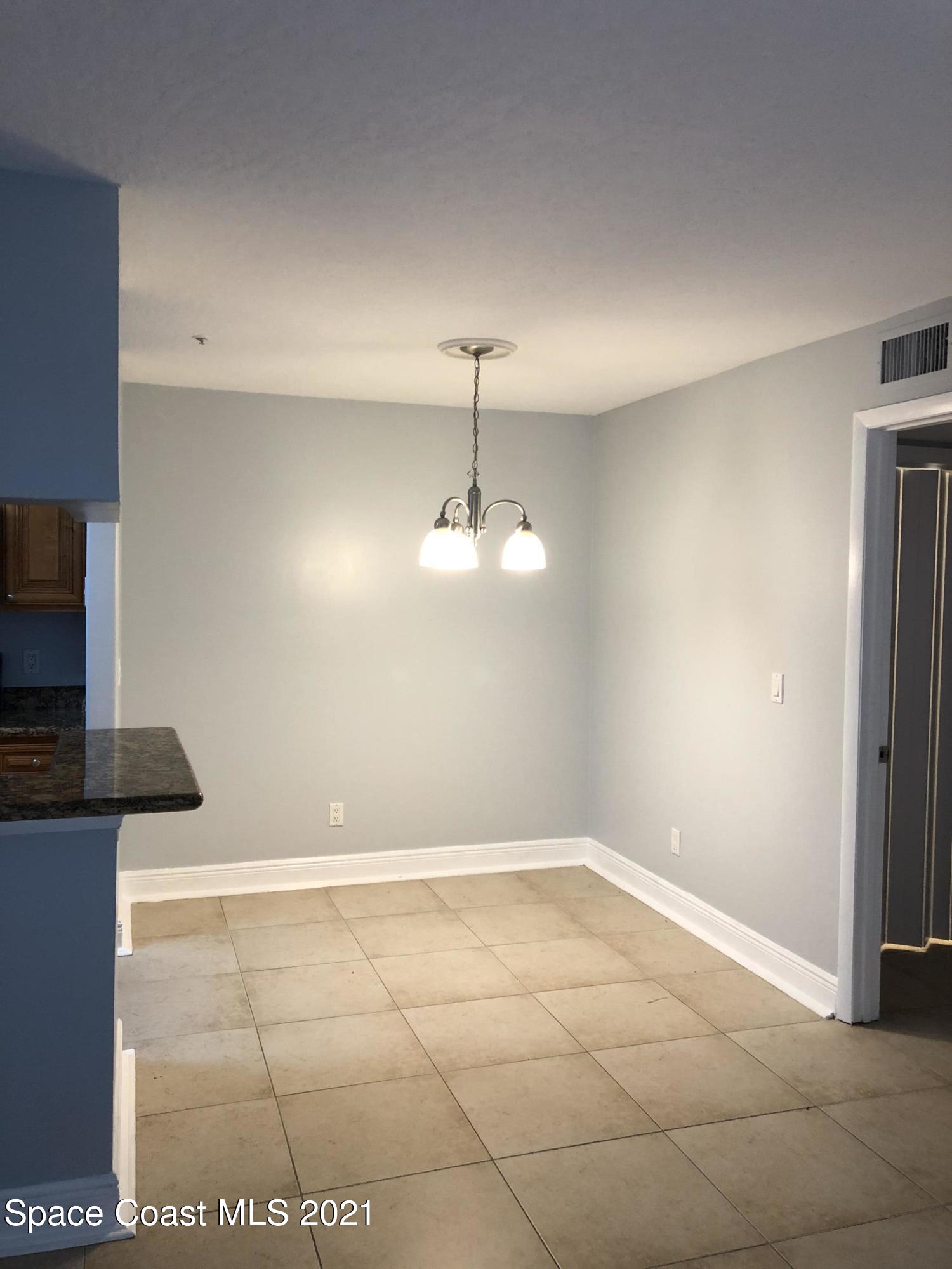 7667 North Wickham Road, Unit 406 Melbourne, FL 32940 - Photo 10 of 28 DINNING ROOM