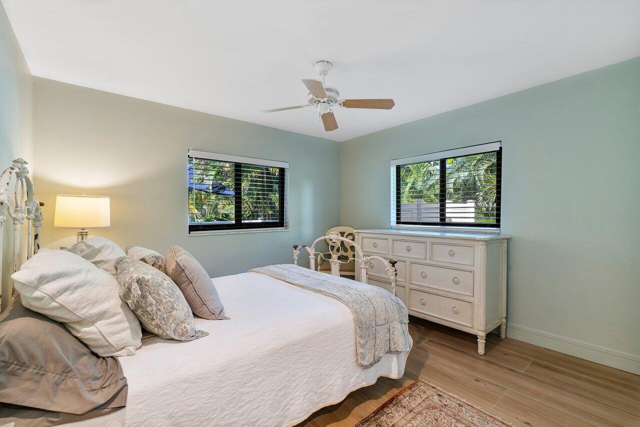 1280 Singer Drive Singer Island, FL 33404 - Photo 14 of 39 a bedroom with a bed and a window