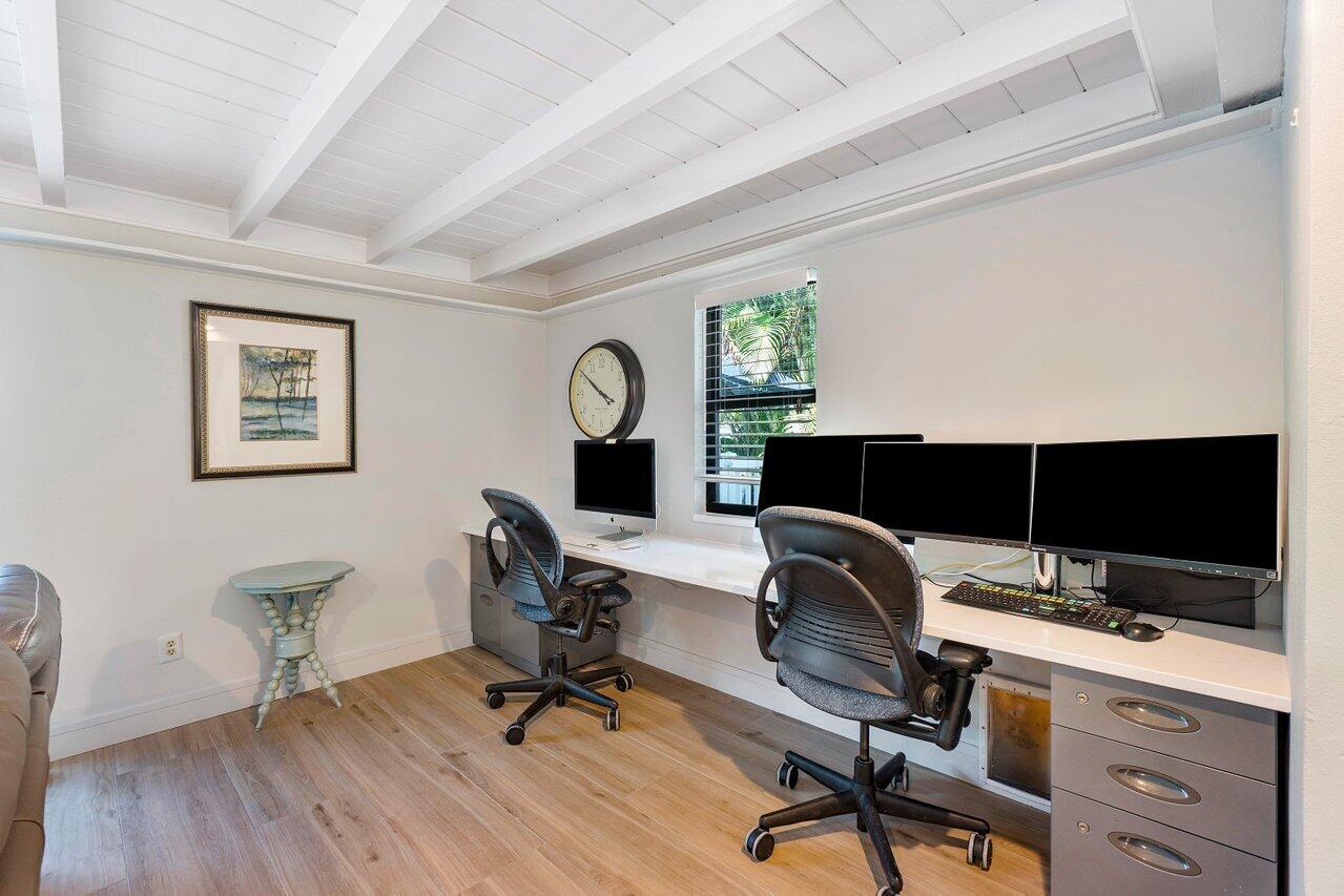 1280 Singer Drive Singer Island, FL 33404 - Photo 15 of 39 a view of a workspace with furniture and a window