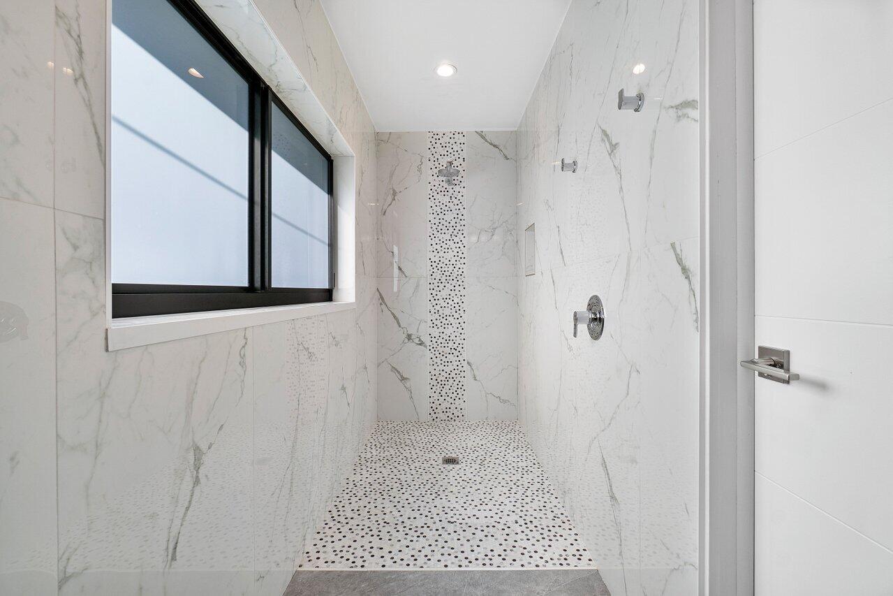 1280 Singer Drive Singer Island, FL 33404 - Photo 20 of 39 a bathroom with a shower