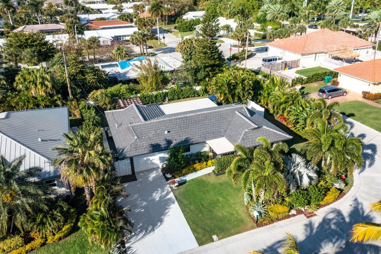 1280 Singer Drive Singer Island, FL 33404 - Photo 26 of 39 an aerial view of a house with a yard and garden