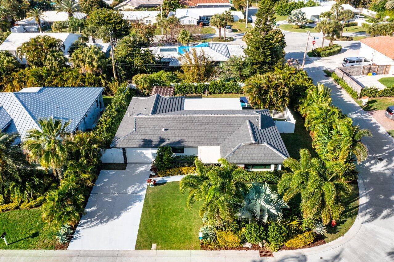1280 Singer Drive Singer Island, FL 33404 - Photo 27 of 39 an aerial view of a house with a garden and trees