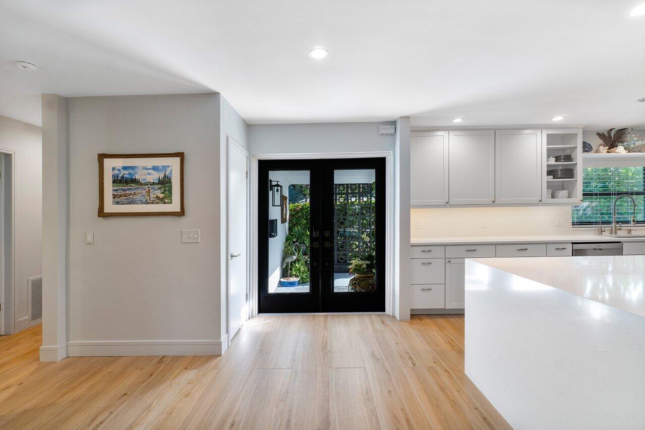 1280 Singer Drive Singer Island, FL 33404 - Photo 5 of 39 a view of a kitchen with a sink and a window