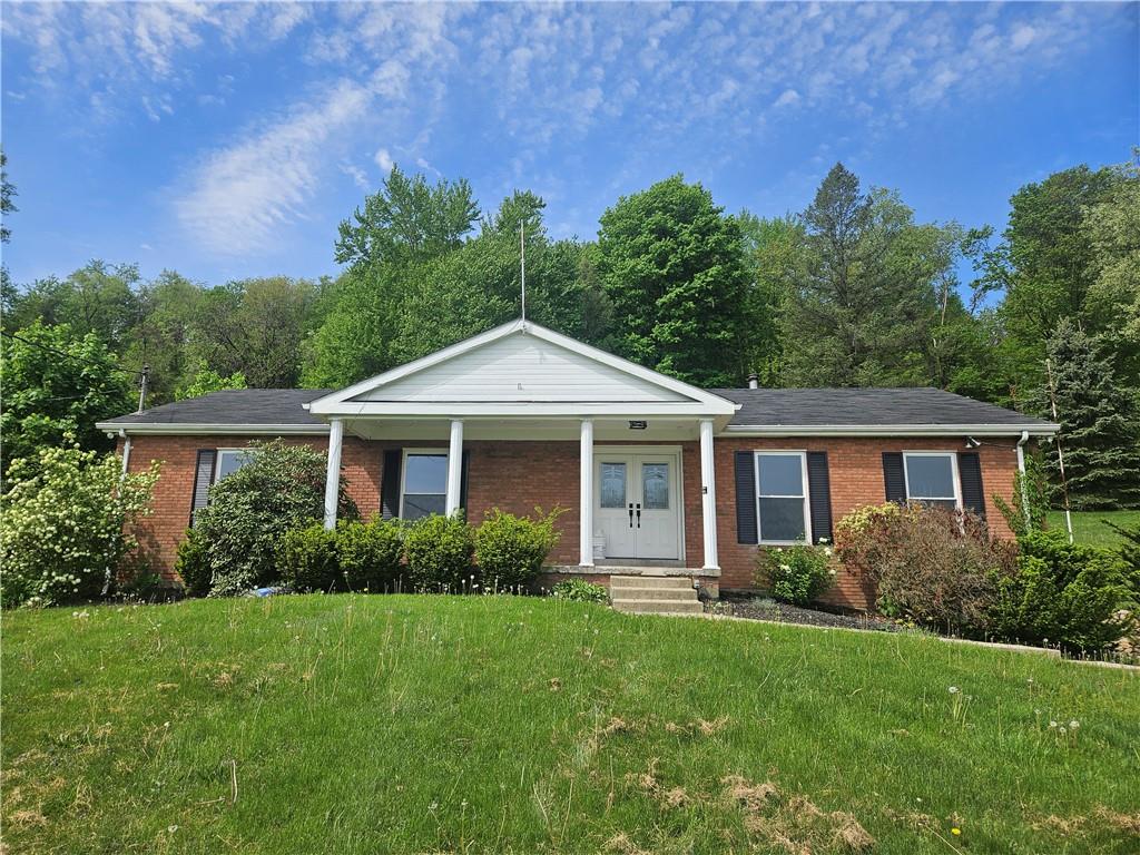 119 Moores Road Aliquippa, PA 15001 - Photo 1 of 1 a front view of a house with a yard