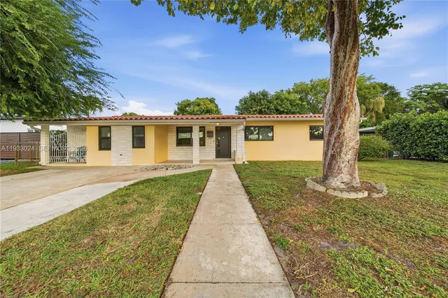 front view of a house with a yard