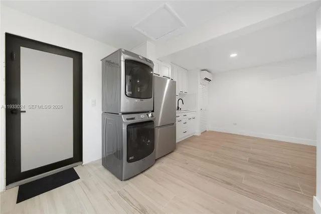 a view of a kitchen with a sink and dishwasher