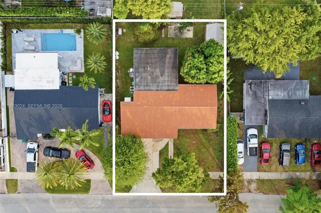 an aerial view of residential houses with outdoor space