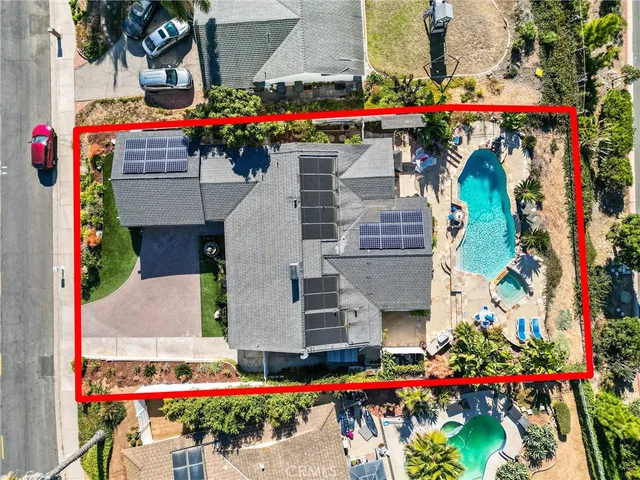 an aerial view of house and yard