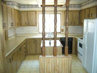 16872 Stagecoach Road Corning, CA 96021 - Photo 4 of 8 a kitchen with stainless steel appliances granite countertop a refrigerator and a stove