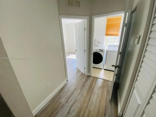 a view of a porch with wooden floor