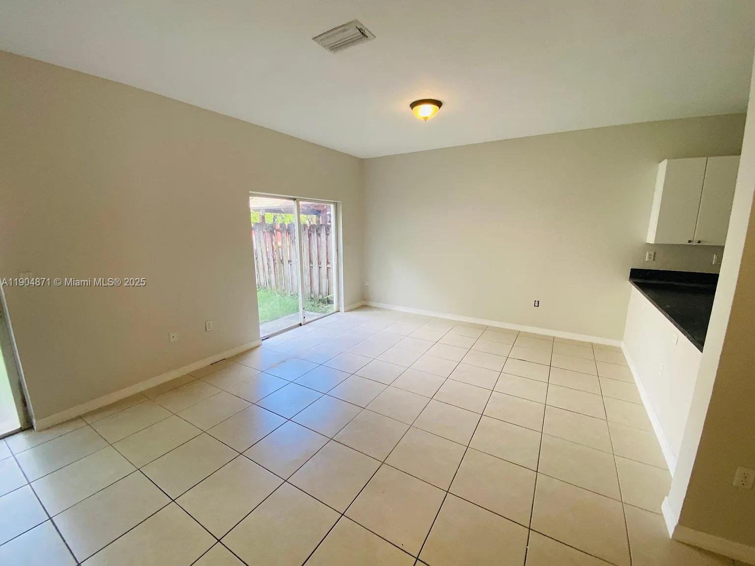 4947 Southwest 135th Way Miramar, FL 33027 - Photo 10 of 17 an empty room with windows
