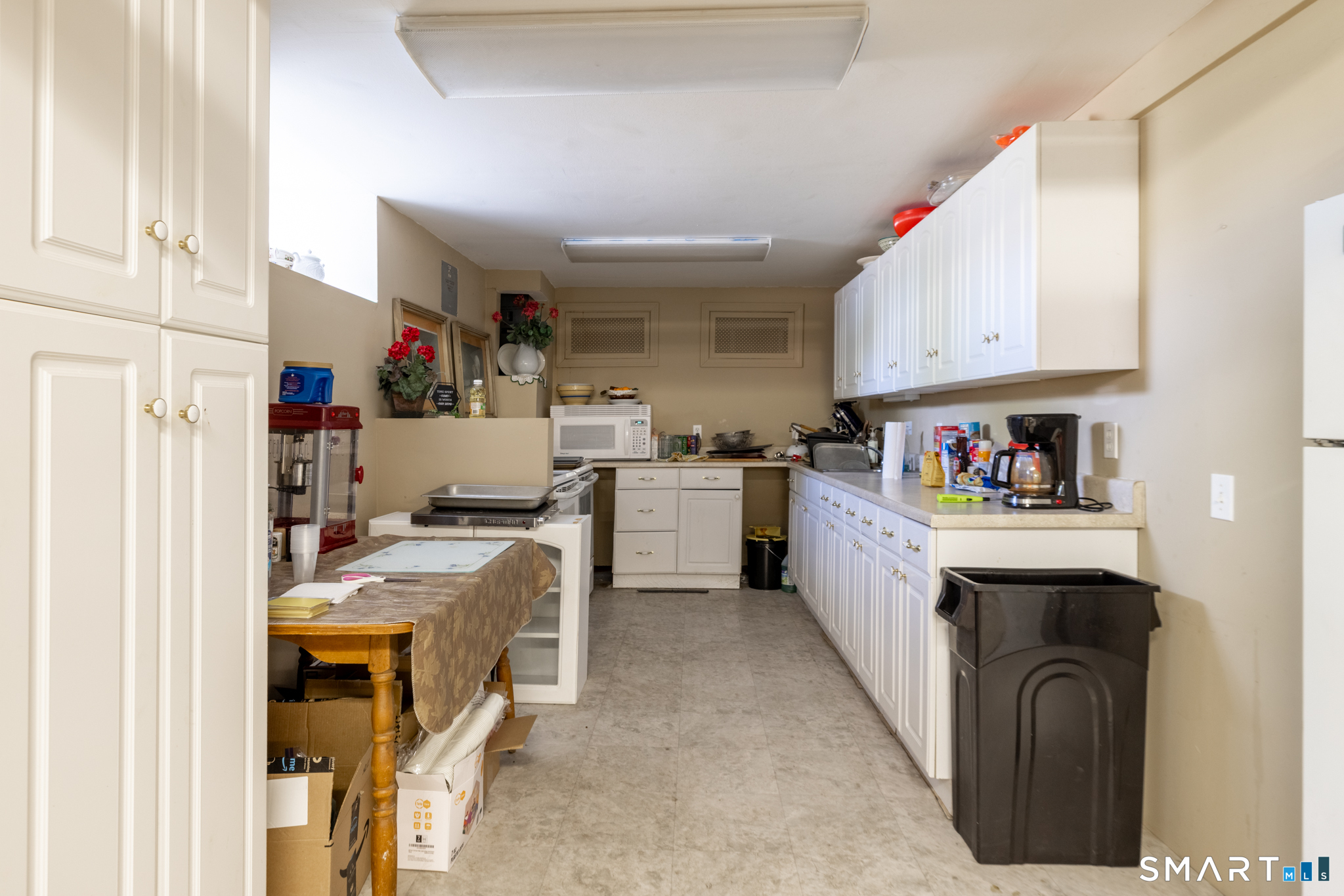 523 West Street Bristol, CT 06010 - Photo 19 of 30 a kitchen with a refrigerator and sink