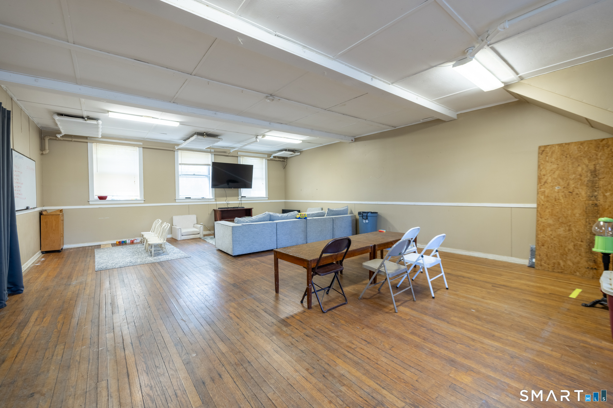 523 West Street Bristol, CT 06010 - Photo 22 of 30 a living room with furniture and a wooden floor