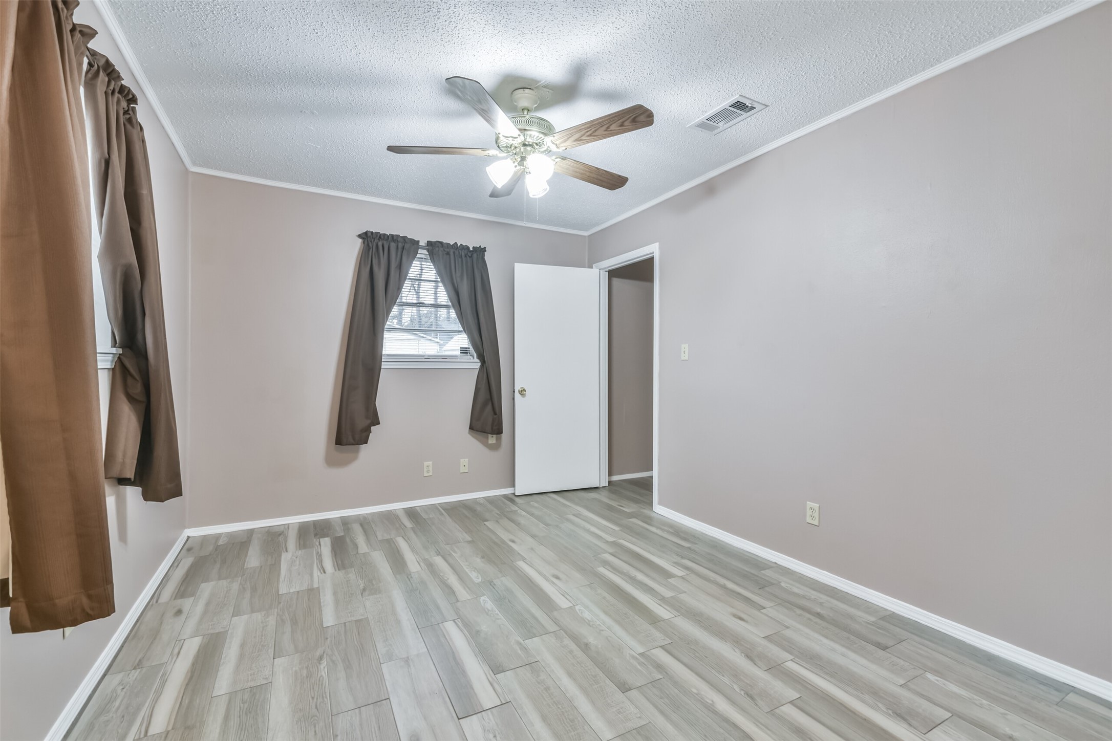 23807 Red Oak Drive Spring, TX 77389 - Photo 20 of 26 wooden floor in an empty room with a window