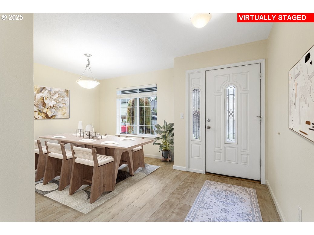 1575 Southeast Dexter Lane Gresham, OR 97080 - Photo 11 of 48 a living room with a table chairs and a kitchen view