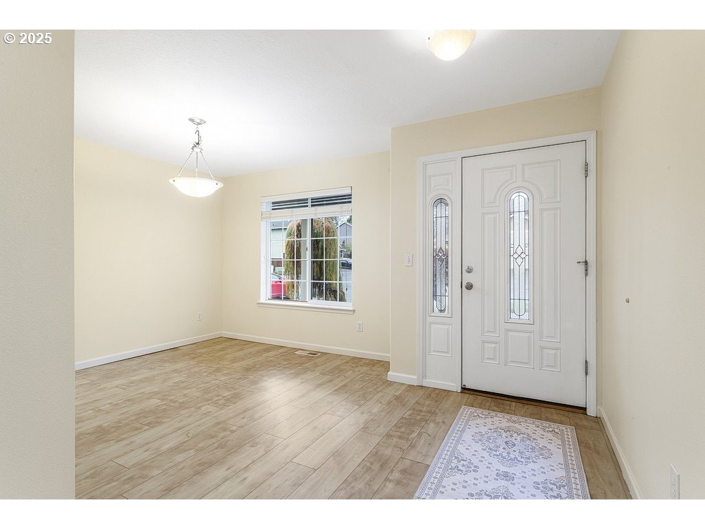 1575 Southeast Dexter Lane Gresham, OR 97080 - Photo 12 of 48 a view of an empty room with a window