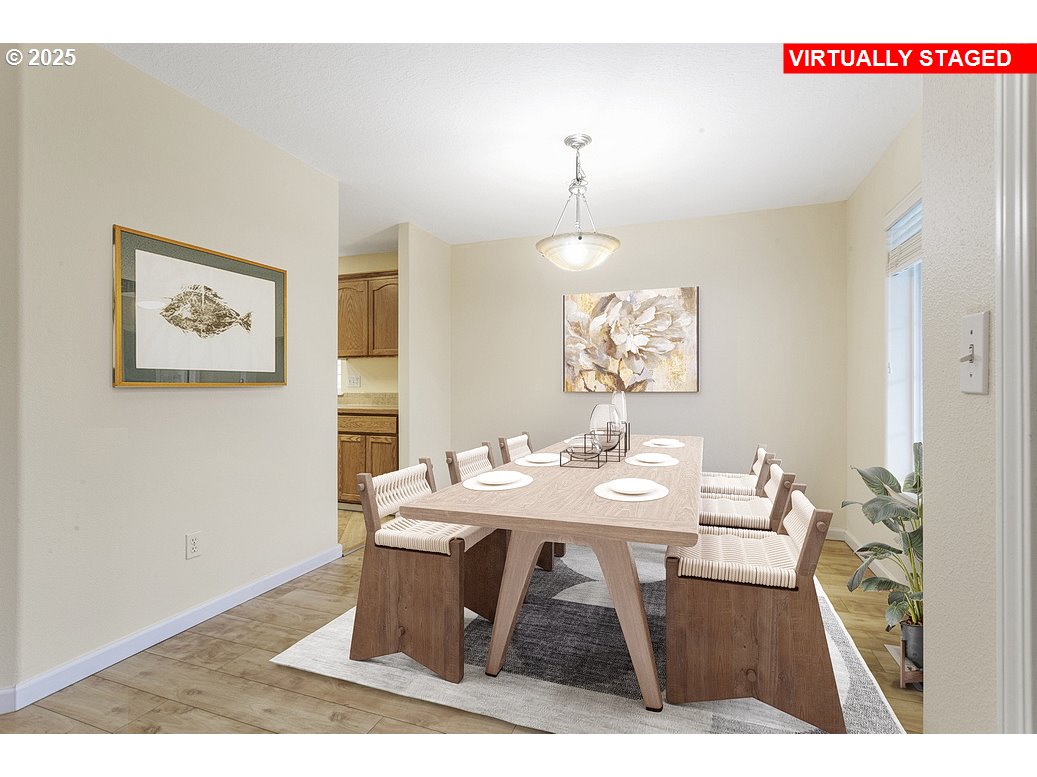 1575 Southeast Dexter Lane Gresham, OR 97080 - Photo 13 of 48 a view of a dining room that has a table and chairs in it
