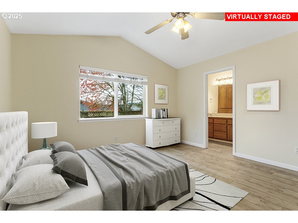 1575 Southeast Dexter Lane Gresham, OR 97080 - Photo 27 of 48 a bedroom with a bed and a chandelier