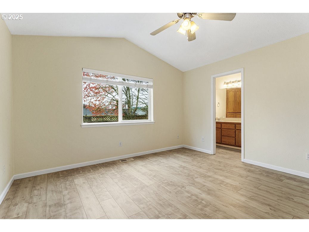 1575 Southeast Dexter Lane Gresham, OR 97080 - Photo 28 of 48 wooden floor in an empty room with a window