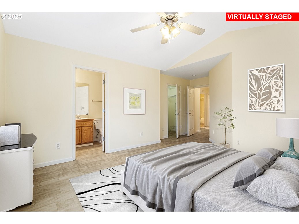 1575 Southeast Dexter Lane Gresham, OR 97080 - Photo 29 of 48 a bedroom with a bed and a chandelier