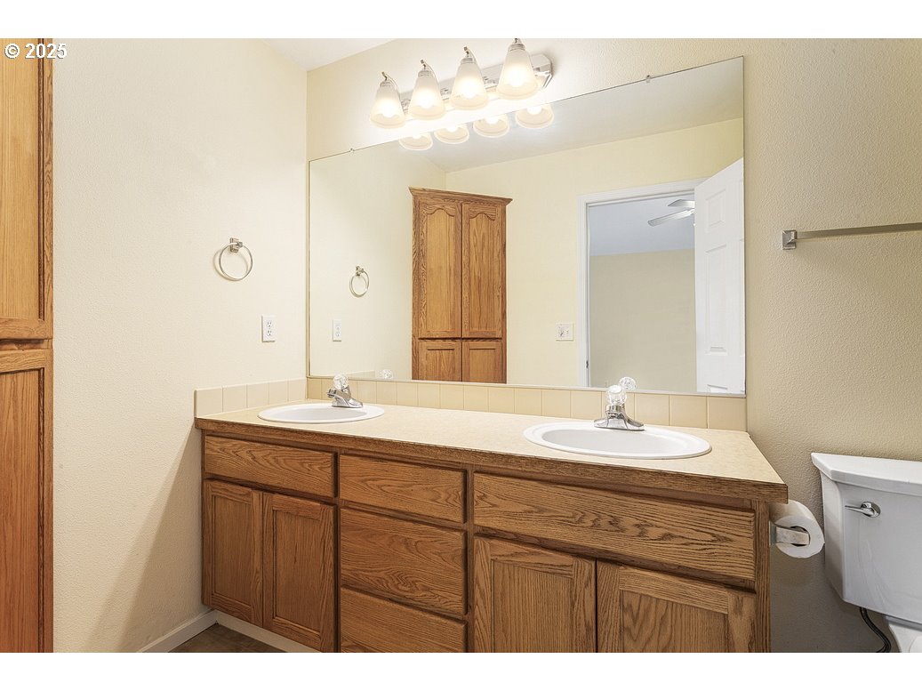 1575 Southeast Dexter Lane Gresham, OR 97080 - Photo 34 of 48 a bathroom with a sink and a mirror
