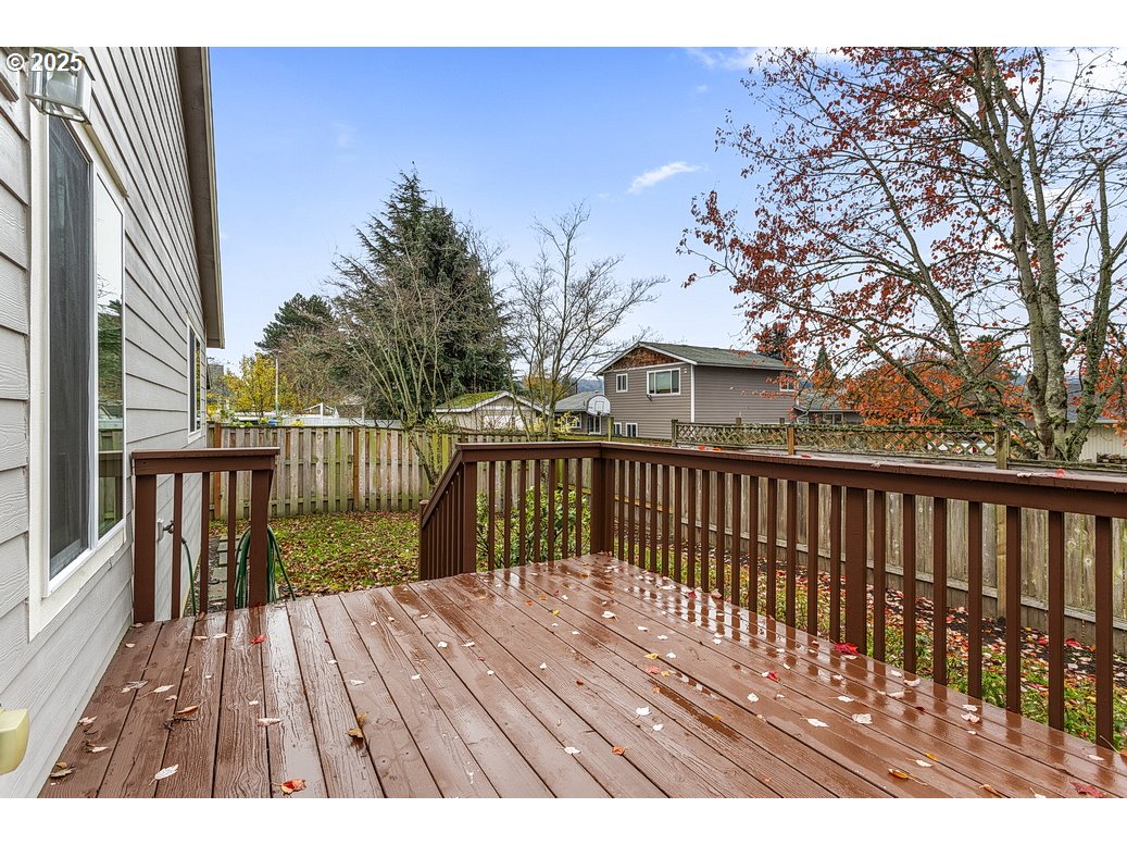 1575 Southeast Dexter Lane Gresham, OR 97080 - Photo 46 of 48 a view of balcony with wooden floor and fence