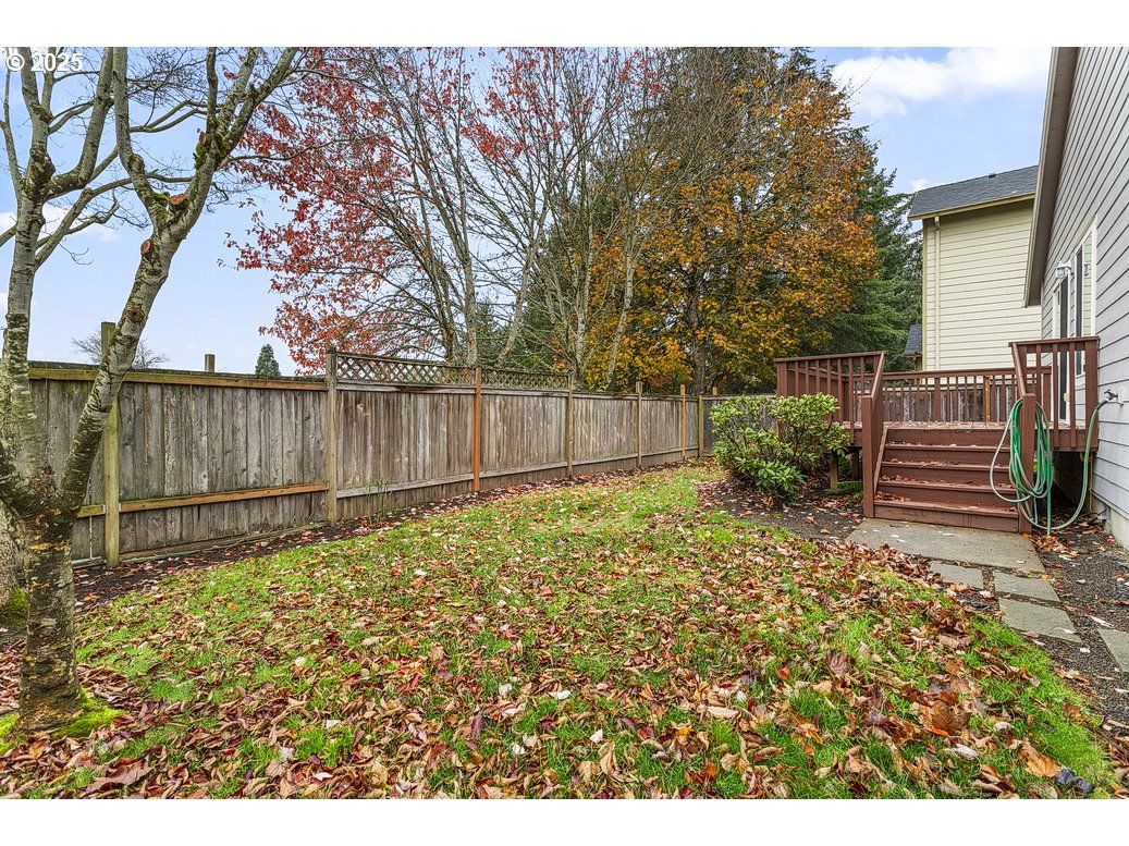 1575 Southeast Dexter Lane Gresham, OR 97080 - Photo 47 of 48 a view of a backyard with wooden fence