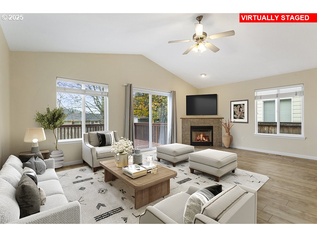 1575 Southeast Dexter Lane Gresham, OR 97080 - Photo 5 of 48 a living room with furniture a chandelier and a floor to ceiling window