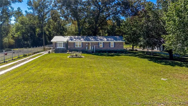 a view of a house with a big yard