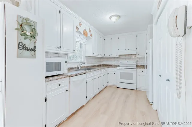 a bedroom with a bed and a mirror on dresser