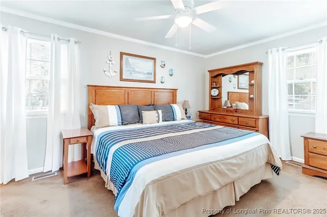 a view of a house with a garden and pathway