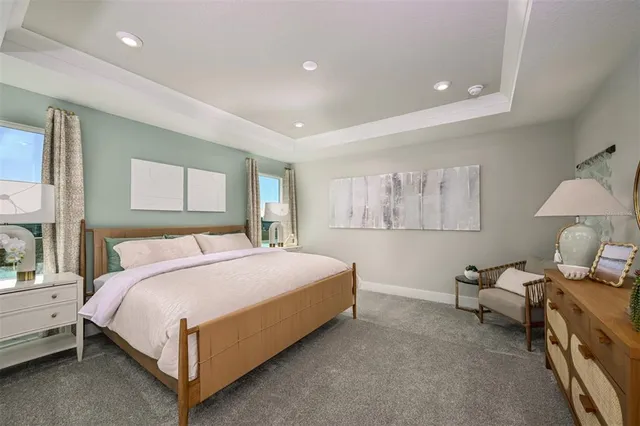 a bathroom with a granite countertop sink a mirror and shower
