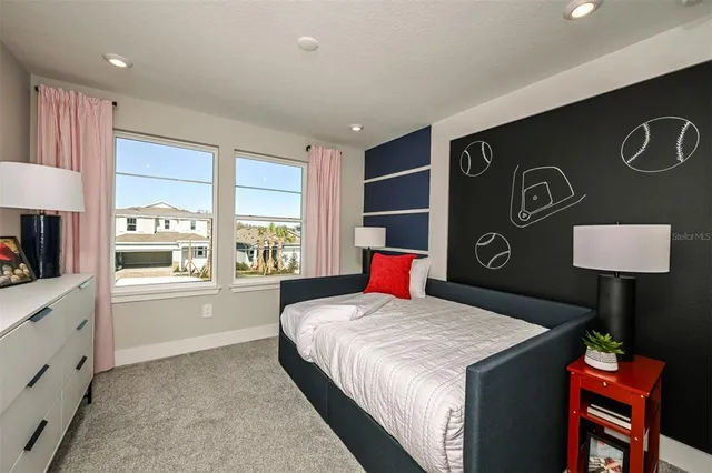 a bathroom with a sink a toilet a mirror and shower