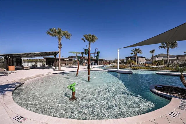a view of a backyard with sitting area
