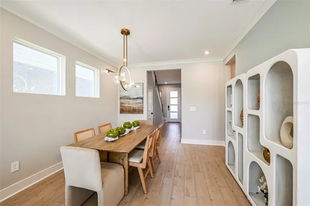 a living room with furniture fireplace and large windows