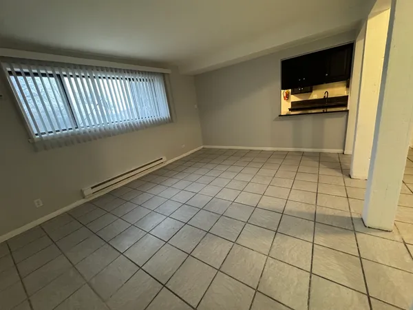 a view of an empty room and window